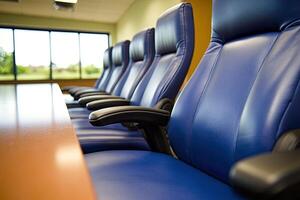 A row of blue leather chairs photo