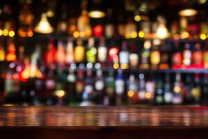 Bar counter with blurred bottles and lights photo