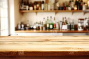 Wooden table top in front of a bar photo