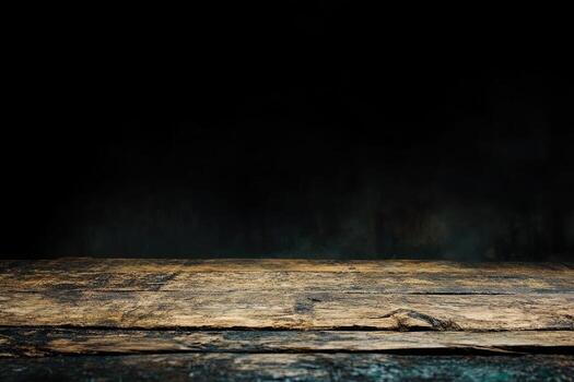An empty wooden table in a dark room photo