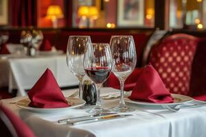 A table with two wine glasses and a napkin photo