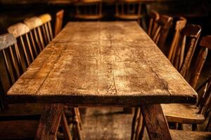 An old wooden table and chairs in a room photo
