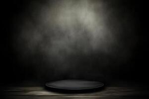 An empty black plate on a wooden table in a dark room photo