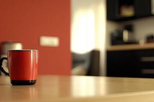 A red coffee mug sitting on a table photo