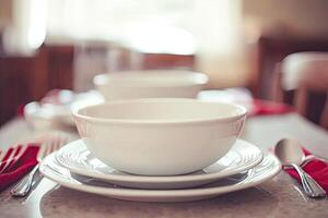 A table with a bowl and plate on it photo