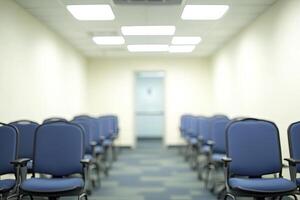 Empty chairs in a conference room with a white wall photo