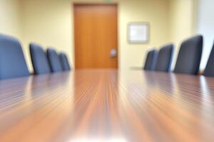 A conference table is shown in a room with chairs photo
