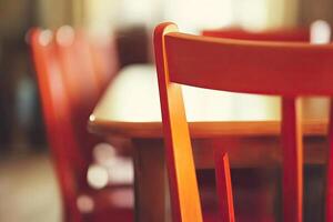 A close up of a wooden table and chairs photo
