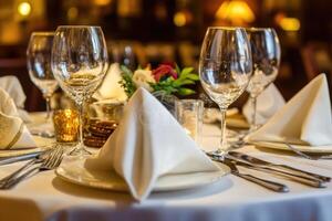 A table setting with white napkins and silverware photo
