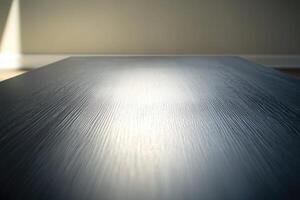 An empty table with a light shining on it photo