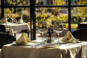 A table with two glasses and a napkin on it photo