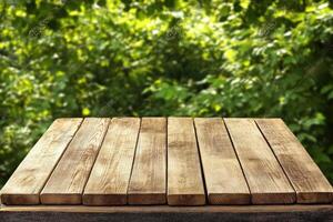 Wooden table with green background photo