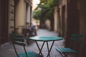 A table and two chairs on a street photo