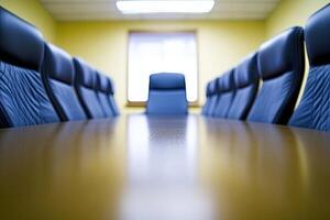 A conference room with blue chairs and a large table photo