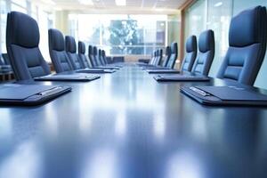 A conference table with black leather chairs photo