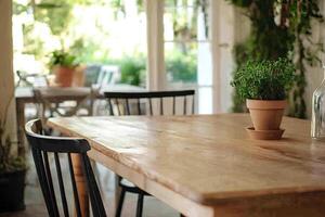 A wooden table with a potted plant on it photo