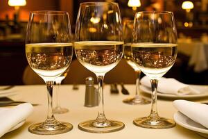 Three wine glasses on a table photo