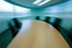 A blurry image of a conference table photo