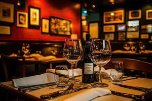 A table with two wine glasses and two wine bottles photo