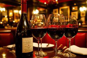 A table with wine glasses and a bottle of wine photo