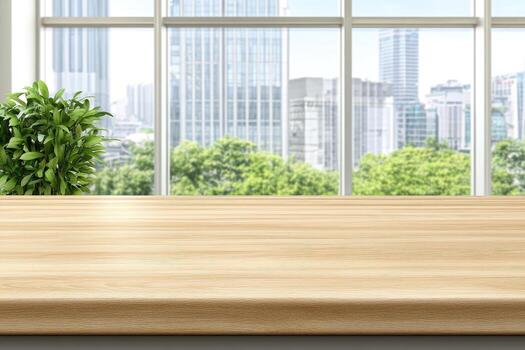 Empty wooden table in front of a window with city view photo