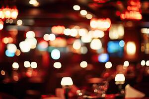 A blurry image of a restaurant with lights photo