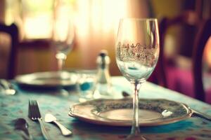 A table with a plate and wine glass photo