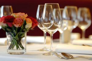 A table with a vase of flowers photo
