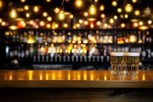 Two glasses of beer on a bar counter photo