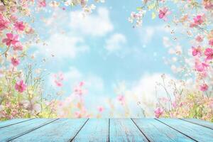 Wooden table with flowers and sky background photo