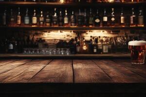 A glass of beer sits on a wooden table in front of a bar photo