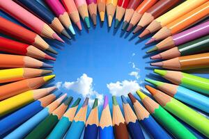 Color pencils in circle with blue sky photo