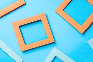 Colorful square frames on blue background photo