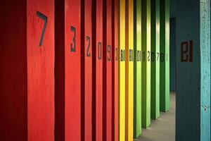 A row of colorful wooden poles photo