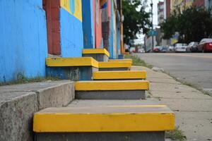 Steps in front of a colorful building photo