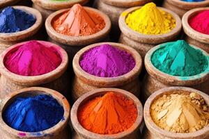 Colorful holi powder in wooden bowls photo