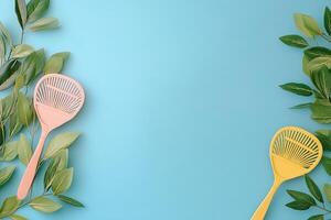 Two colorful plastic spatulas on a blue background photo