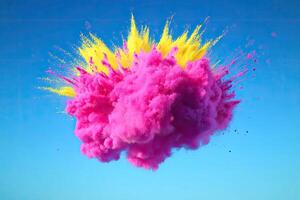 A pink cloud of powder is being thrown into the air photo