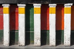 A red, green, and yellow painted wall photo