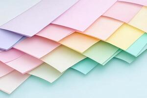 A pile of colorful paper sheets on a blue background photo