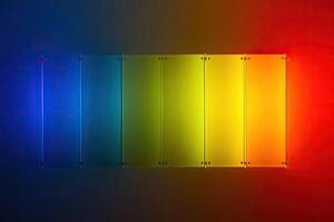 A rainbow colored light panel on a black background photo