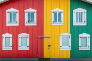 A colorful building with a red, yellow, and green door photo