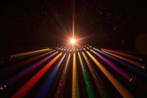 A rainbow of colored pencils are arranged in a circle photo