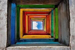 A colorful square window with a blue sky in the background photo