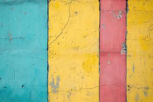Colorful painted wall with a blue, yellow, red and pink stripe photo