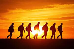 Hiking group at sunset photo