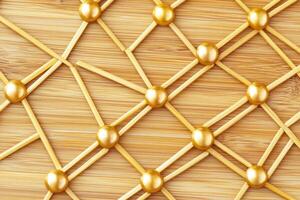 Golden network on a light brown wooden surface photo