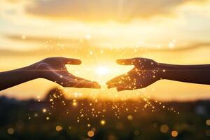 Two hands reaching for a golden light photo