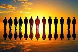 Silhouettes of people on a reflective surface at sunset photo