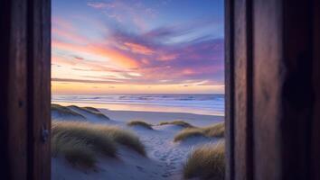 Sunset Ocean View Through Open Door Frame with Sand Dunes photo